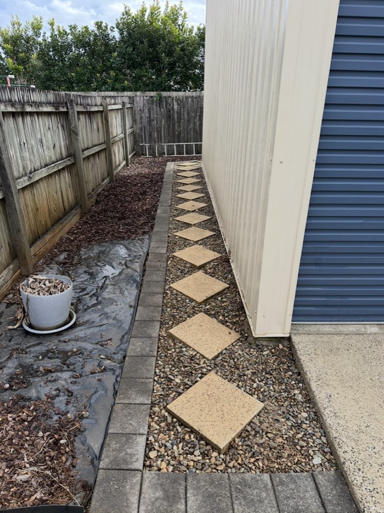 The same stepping-stone path clean and light after pressure washing